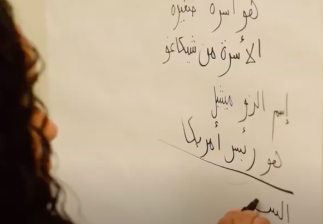 Student-writing-in-Arabic